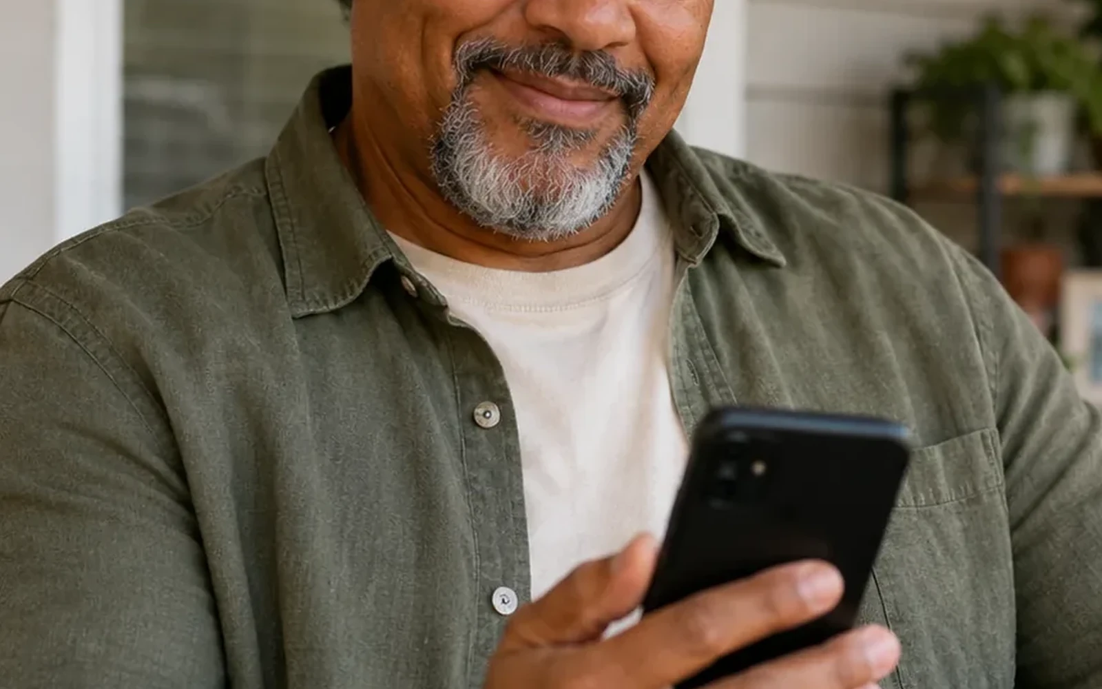 A member reviewing information on a smartphone while preparing for a healthcare conversation
